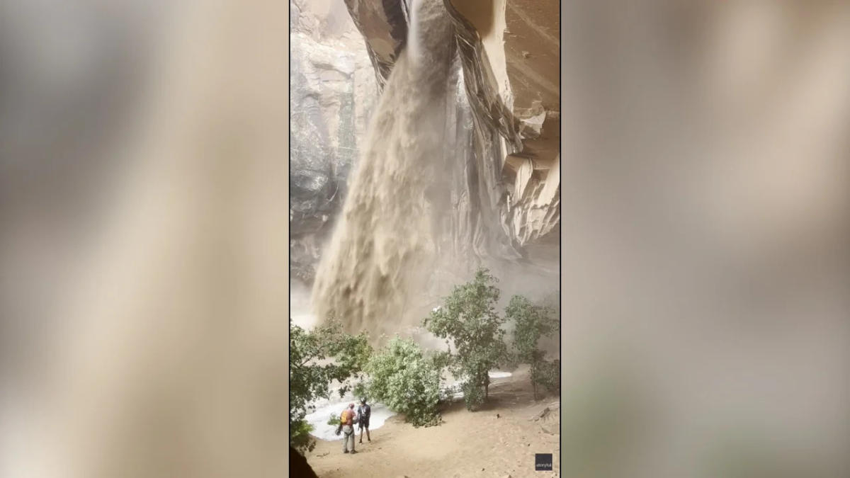 Climber rappels next to raging muddy waterfall sparked by flash floods in Utah [Video]